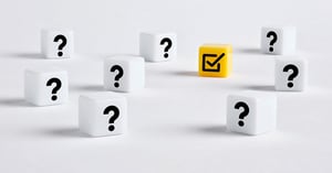 White blocks with question marks around one yellow box with a checkmark